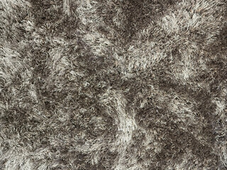 Close up of carpet rug flooring in tuft bump map texture in black and white color. Seamless modern minimalist rug texture with tufted fur. Suitable for living room floor.
