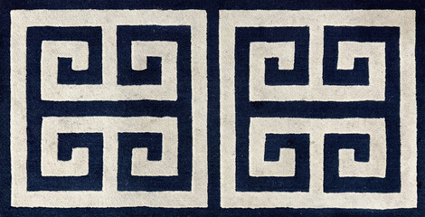 Pattern of a Greek Key or Meander Geometric Pattern rug carpet flooring in white and black colors....