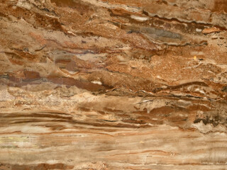 Texture of red marble with random red veins and white grains. Mineral marble seamless background texture.