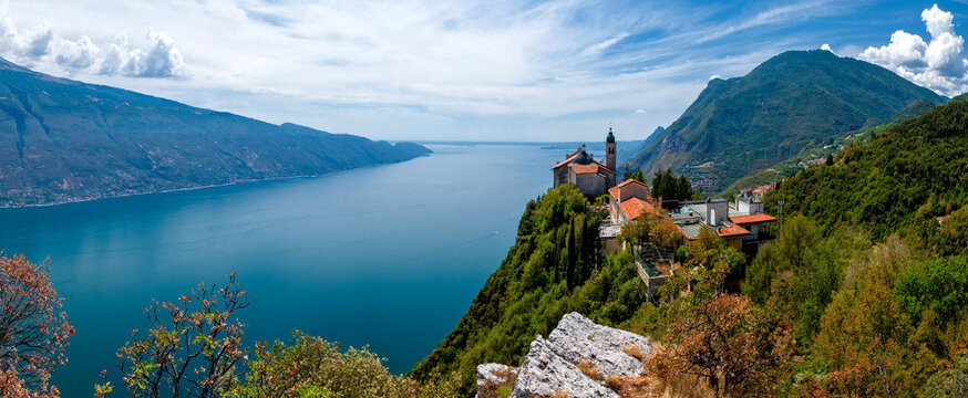 Lake Garda (Lago di Garda) with famous pilgrimage church Madonna di Montecastello high above in the mountains near Tignale in Italy
