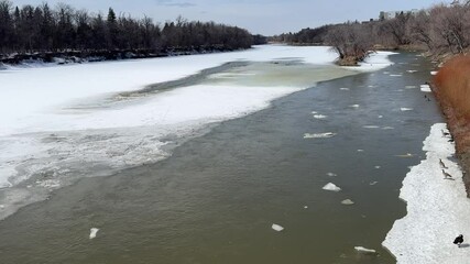 Melting ice on the river in early spring - Powered by Adobe