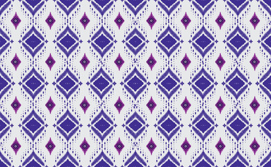 Intricate diamond pattern in indigo and violet tones. This seamless design features a textured weave effect