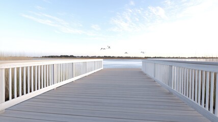 Wooden boardwalk leads to serene lake view under clear sky with distant horizon.