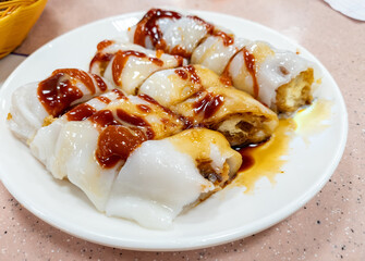 A dish of Yautiao roll with sweet savoury sauce. A Cantonese Dim Sum dish of crispy fried dough...