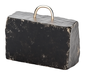 Dark stone sculpture subtly gleams under soft light; minimalist composition evokes quiet strength.. AI Generated