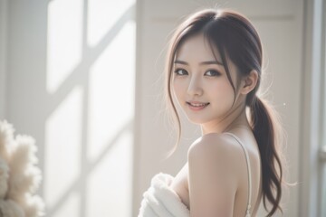 Young Asian Woman Wrapped in Towel Smiling in Sunlight, Beauty, Skincare, Wellness Concept