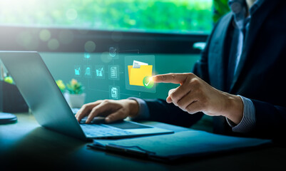 Businessman Using Cloud Computing for Secure Digital File Management on Laptop, Enhancing Remote Work Efficiency, Cybersecurity, and Data Protection for Online Collaboration, Virtual Office Solutions