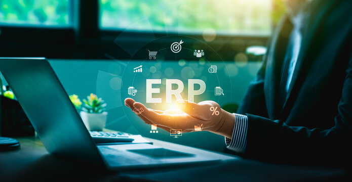 Businessman presenting ERP system with digital icons representing enterprise resource planning, finance, supply chain, analytics, and automation for business management and operational efficiency