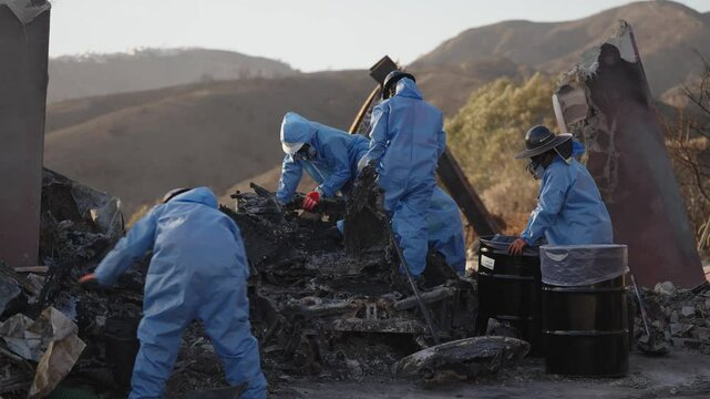 Palisades fire clean up crew in hazmat suits