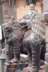 picture of lion statue made from stone or bronze