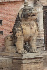 picture of lion statue made from stone or bronze