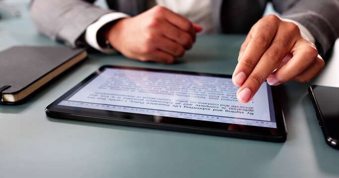 Young African-American man reviews digital script