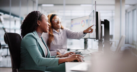 Female Analyst Using Multiple Screens