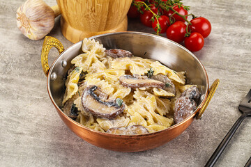 Italian cuisine - farfalle with mushrooms