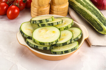 Raw green zucchini slices for cooking