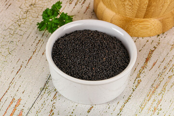 Black dry Nigella seeds in the bowl