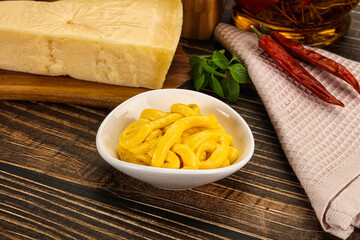 Yellow cheese sauce in the bowl