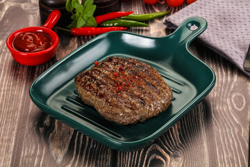 Grilled beef burger cutlet with sauce