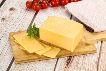 Yellow cheese piece with slices