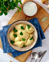 dumplings with sour cream and parsley