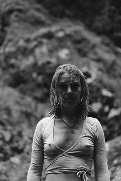 Woman after swimming in a waterfall