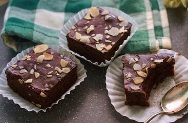 Indulgent, soft chocolate brownies adorned with sliced almonds
