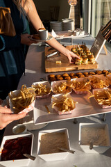 A casual-chic buffet with fries and lobster sliders at a Newport
