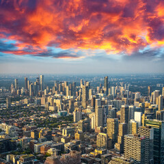 Fototapeta premium Breathtaking sunset aerial shot of Toronto skyscrapers and CN Tower from above