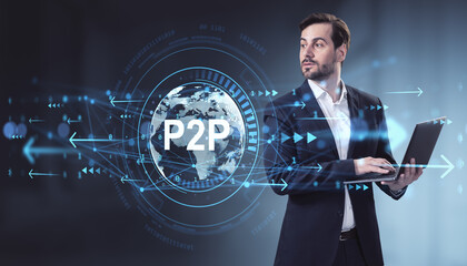Businessman using laptop with P2P global network data interface on modern blue background representing digital technology concept.