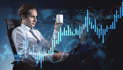 Confident businessman analyzing financial data on digital interface with cup and tablet in hand in modern office environment at night.