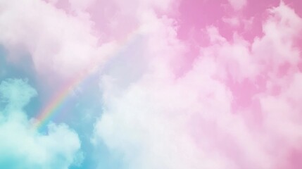 A vibrant rainbow arching across fluffy pink and blue clouds in a serene sky.