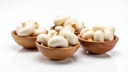 White Button Mushrooms In Wooden Bowls