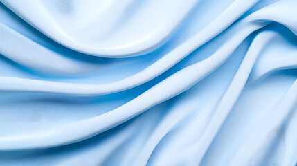 Smooth blue silk fabric background with gentle folds background