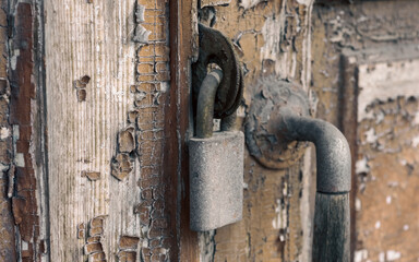 old vintage lock on a wooden door