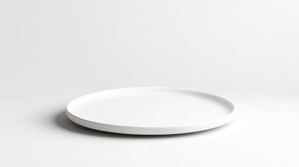 Empty white round plate on white background