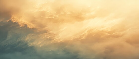 Obraz premium Abstract image of clouds with golden and blue hues creating