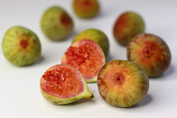Fresh figs on a white background, showing soft texture and rich color