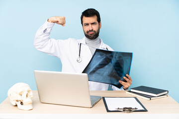 Professional traumatologist in workplace doing strong gesture