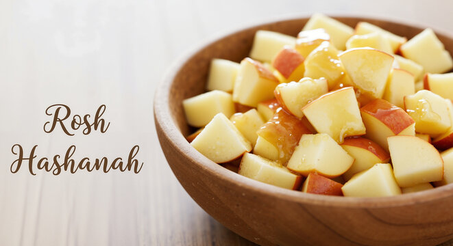 Sliced Apples with Honey in a Wooden Bowl Traditional Dish for Celebrating Rosh Hashanah