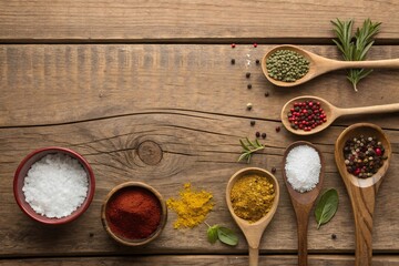 An aromatic symphony of spices and herbs rests on rustic wooden planks, a culinary invitation to savor diverse flavors with warm lighting and natural wood grain.