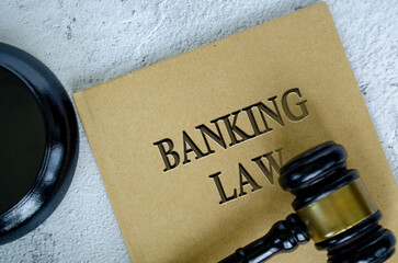 Top view of Banking Law book with gavel on marble background