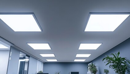 Modern office lighting.  Flat panel LEDs illuminate a contemporary space