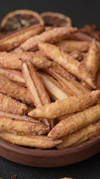 Cinnamon flavored biscuits or breadsticks as a food background.