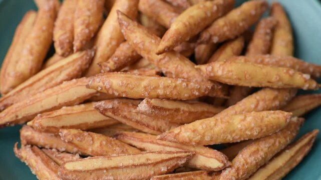 Cinnamon flavored biscuits or breadsticks as a food background.