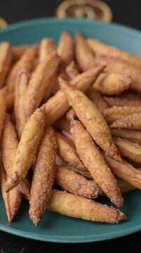 Cinnamon flavored biscuits or breadsticks as a food background.