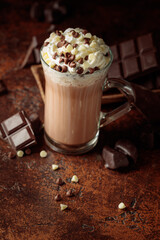 Hot chocolate cocoa drink with whipped cream.