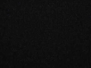 An abyssal black felt texture shrouded in enigma, embodying the silent depth of the night's elegant...
