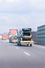 Tow truck loaded with accident-damaged SUV