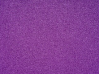 A tapestry of vivid purple, the textured paper speaks of royal elegance and the thrill of the mysterious