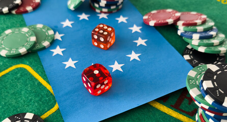 Playing cards, dice and poker chips from above on the green poker table